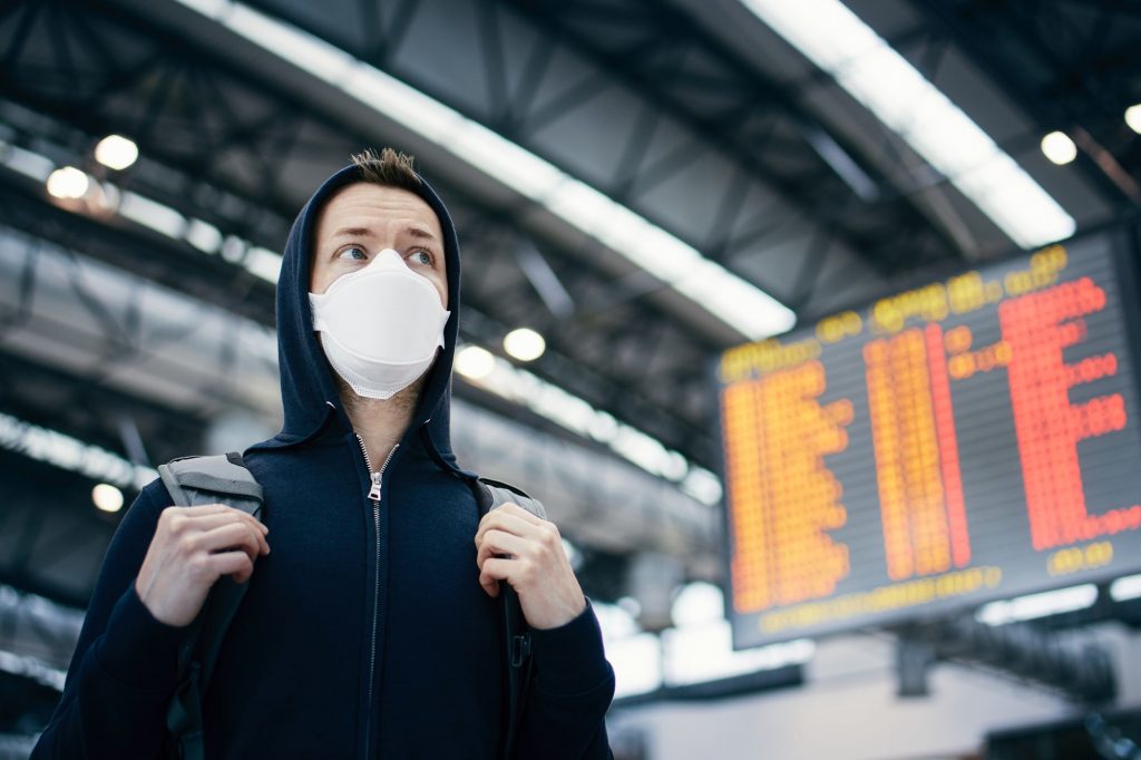 Man wearing protection face mask at airport